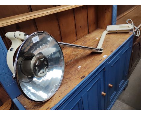 A Sterling enamel and chrome adjustable medical operating light. 