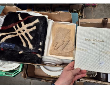 A Burberry scarf and boxed Balenciaga tights.