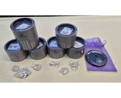Six Swarovski crystal ornaments and a compact 