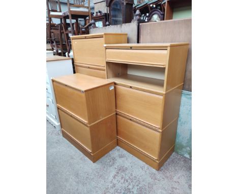Three Swedish Kinnarps light oak tambour front filing cabinets. 