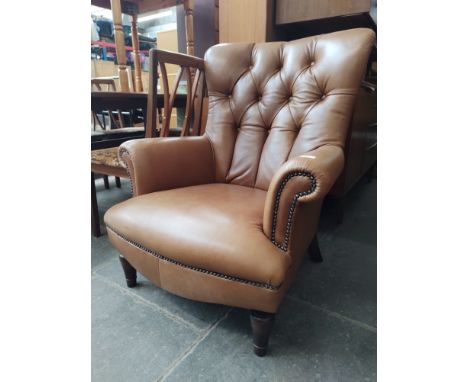 A Tetrad brown leather button back armchair. Condition- good, only light signs of use, no damage or obvious signs of wear.