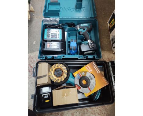 A Makita cordless impact driver with battery and charger, boxed and unused, together with a Makita cordless angle grinder wit