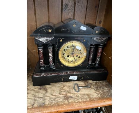 A Victorian black slate and marble mantle clock. 