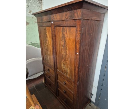 A Victorian mahogany double wardrobe with faux drawers to the front, height 207.5cm, width 147cm and depth 66.5cm.