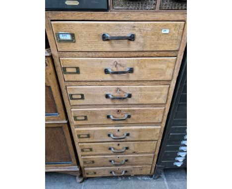 A vintage light oak 8 drawer filing cabinet, height 107cm.