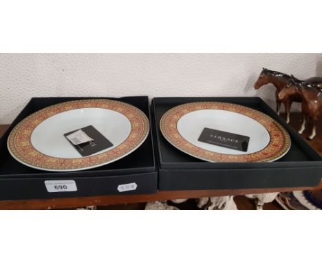 A pair of Versace Rosenthal Medusa dishes, boxed.