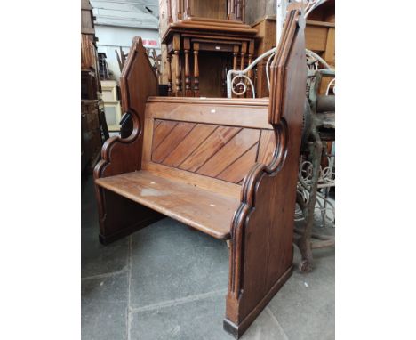 A late Victorian Gothic style pitch pine church pew, width 108cm.