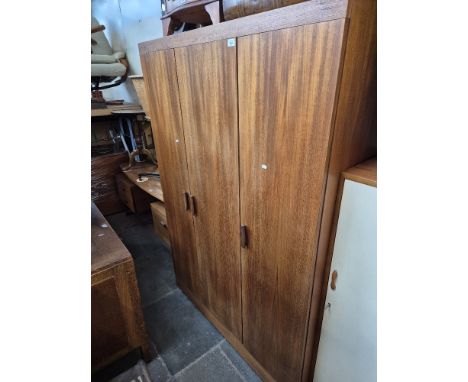 A mid 20th century G Plan teak wardrobe, height 177.5cm  and width 122cm.