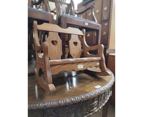 A miniature Arts &amp; Crafts oak rocking bench. 