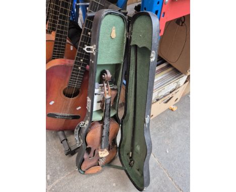 A 20th century Chinese student violin with bow and case.