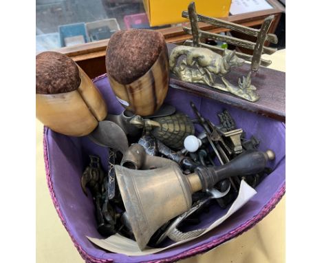A basket of mixed metalware and a pair of taxidermy hooves 