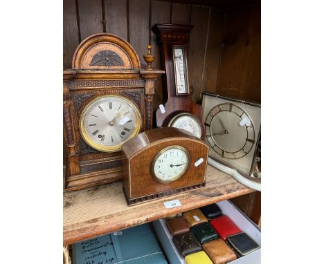 A bracket clock, mantle clock, a barometer and a brass clock on an alabaster base