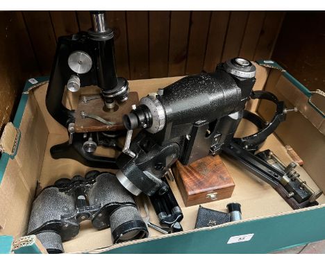 A box containing binoculars, microscope, small tripod, brass sextant, exposure meter, avo mate, keratometer (?)