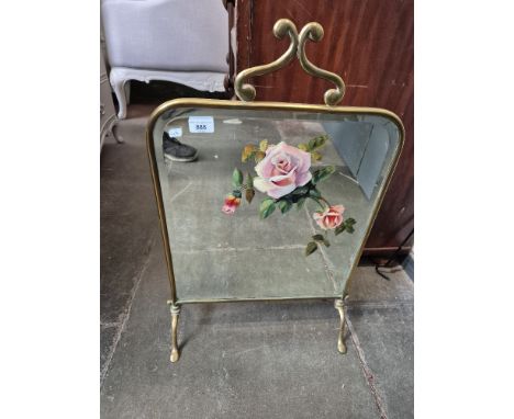 An Edwardian brass and mirrored glass firescreen hand painted with roses. 