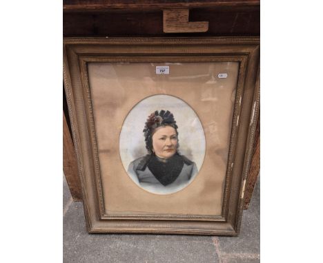 A late 19th/early 20th century overpainted photograph, portrait of a woman, framed and glazed, 57cm x 67cm (overall).