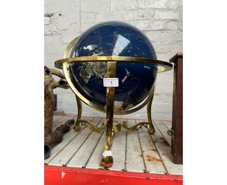 A terrestrial globe, inlaid with various semi precious stones and set on a brass stand.