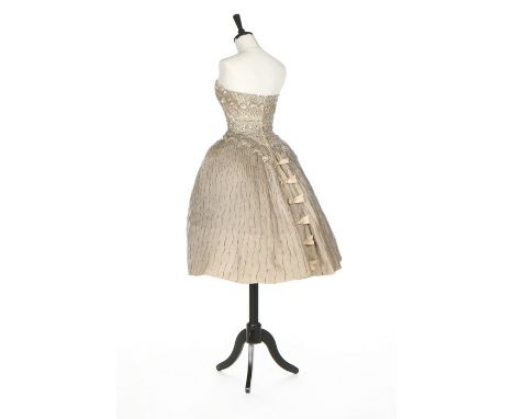 An Elizabeth Arden embroidered cocktail dress, late 1950s, labelled, of silver-grey organza, the bodice and skirt covered wit