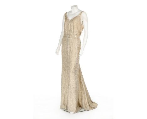 A Norman Hartnell couture ivory and gold sequined evening gown, circa 1938, labelled, with handwritten client name 'Lady Harv