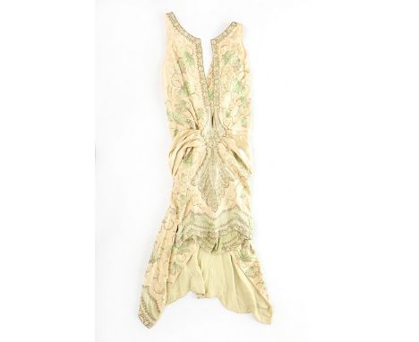 A Callot Soeurs embroidered ivory satin orientalist dress, circa 1926, un-labelled, embroidered in pale green and primrose fl