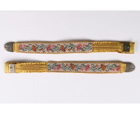 A rare pair of yellow silk and tapestry garters, early 19th century, woven with carnation repeats, with elasticated sections,