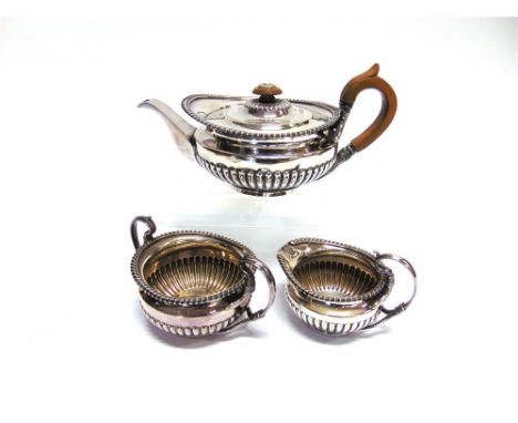 AN ELECTROPLATED THREE PIECE TEA SERVICE in the style of Paul Storr, the round gadrooned bodies with bifurcated serpent handl