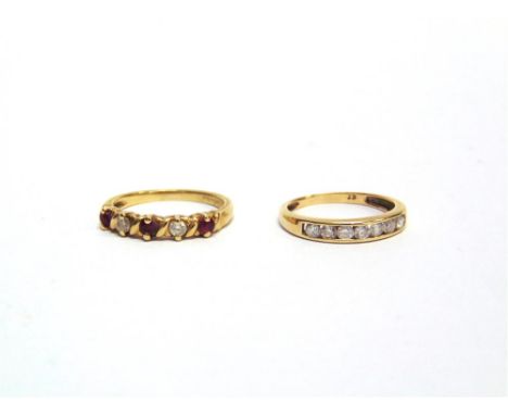 A 9 CARAT GOLD FIRE STONE DIAMOND & RUBY HALF HOOP RING finger size K and a 9 carat gold cubic zirconia half hoop ring, finge