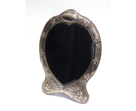 A LARGE SILVER ART NOVEAU HEART SHAPED DRESSING TABLE MIRROR by A & J Zimmerman, Birmingham 1903, the border decorated with s