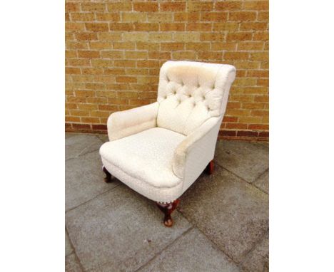 A CREAM COLOURED BUTTON UPHOLSTERED ARMCHAIR,  71cm wide 86cm deep 85cm high