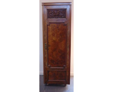 A BURR WALNUT WARDROBE,  adapted from a compactum, decorated with a carved panel, 64cm wide 55cm deep 196cm high
