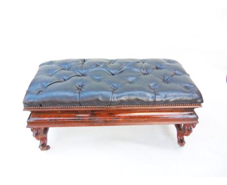 A VICTORIAN DUET STOOL  with button upholstered lifting top on carved stretcher base, 102cm wide 47cm deep 52cm high