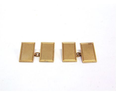 A PAIR OF CUFFLINKS  stamped '9ct', the rectangular engine turned panels with chain connectors, 4.8g gross 