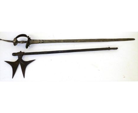 An 18th Century Indian Khanda, the 88cm single edge steel blade with a narrow fuller along the back edge, reinforced at the r