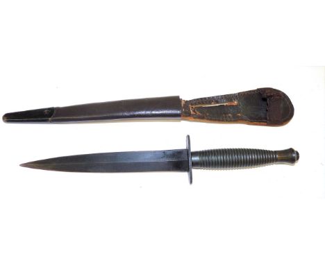 A Third Pattern Commando Knife, with blackened machine forged steel blade, the crossguard stamped WILLIAM. RODGERS, SHEFFIELD