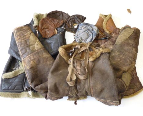 A Pair of Second World War RAF Irvin Sheepskin Lined Flying Trousers, with leather and elasticated braces, the brass zips wit