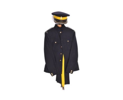 The blue dress uniform of Maj Henry Tufnell, Sussex Yeomanry, c 1939, comprising peaked cap with yellow band, bullion edge to