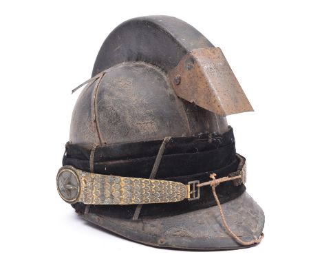 A mid 19th century continental cavalry officer's helmet, with leather skull, peak and crest, brass trim to peak, black velvet