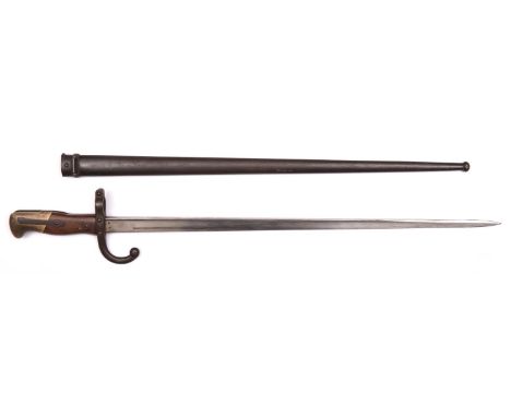 A French 1874 pattern Gras bayonet, the blade marked "St Etienne 1879", in its scabbard, the bayonet and scabbard with matchi