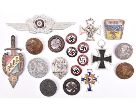 A Third Reich Mothers Cross in gilt and enamel, 5 enamelled party badges; 6 Day badges; a police service medal and 6 other it