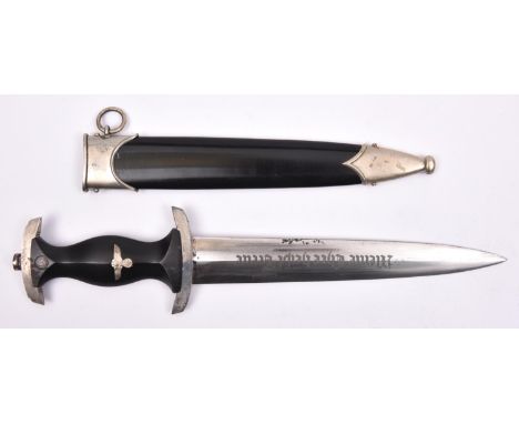 A Third Reich SS man's dagger, 8½", blade etched "Meine Ehre Heist Treue", maker Puma Solingen. In its WM mounted black finis