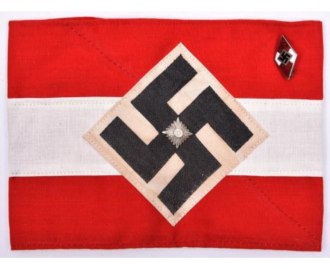 A Third Reich Hitler Youth armband, with applied diamond swastika patch and centrally mounted "Pip"; also a Hitler Youth enam