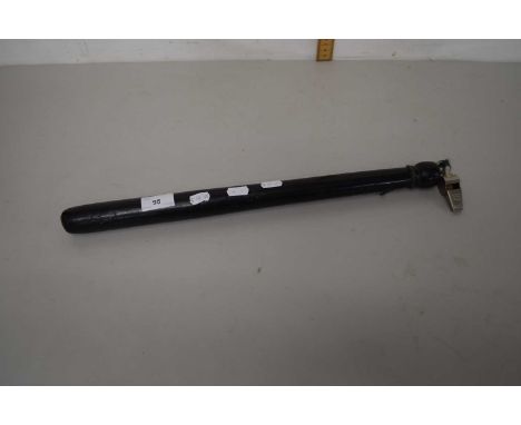 A vintage dark stained wooden truncheon and whistle