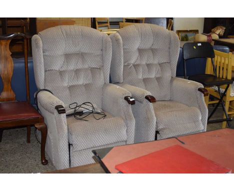 Pair of button back recliner chairs