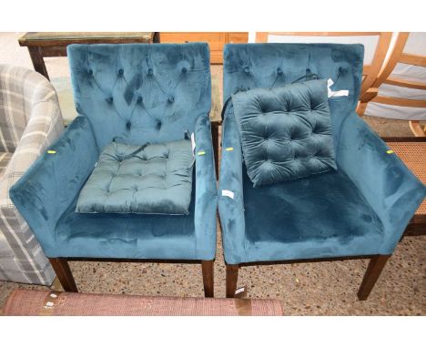 A pair of modern button back armchairs