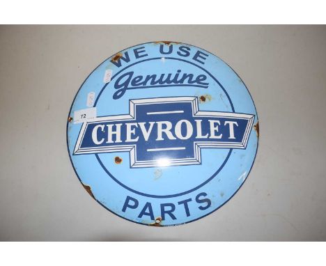 A circular enamel sign We Use Genuine Chevrolet Parts