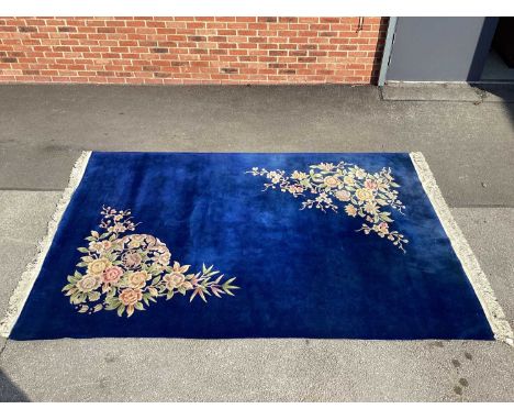 XX Century Wool Carpet with a Blue Ground with Floral Decoration and tassel ends 214 x 310.