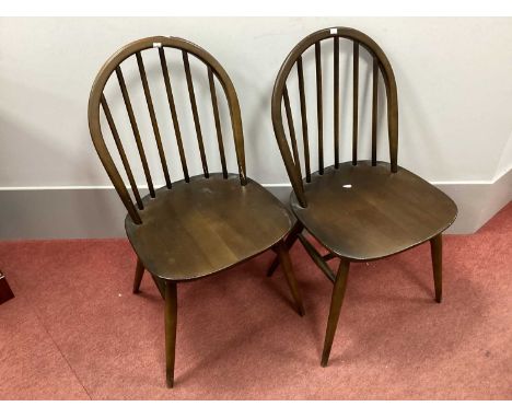 Pair of Dark Ercol Dining Chairs, with hooped back, rail supports.