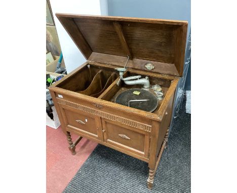Gilbert of Sheffield Record Player in Oak Cabinet, having barley twist legs, with winder and some needles in tin, a quantity 
