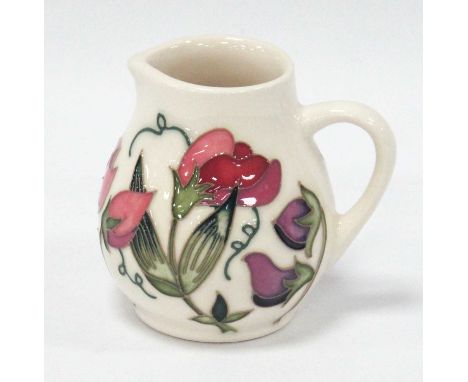 A Moorcroft Pottery Jug, painted in the 'Sweetness' design by Nicola Slaney, shape 3/3, impressed and painted marks, 10cm tal