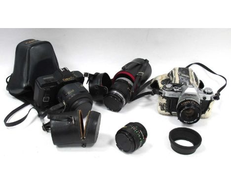 Canon AE-1 camera with Canon FD 50mm f/1.8 lens, Canon T80, Canon FD 100mm f/2.8 and Canon FD 28mm f/2.8. One Tray