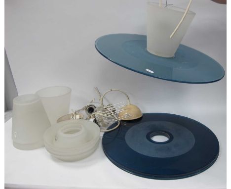 A Set of Four Italian Hanging Light Fittings, the large circular blue/grey glass discs with central openings to hold the fros